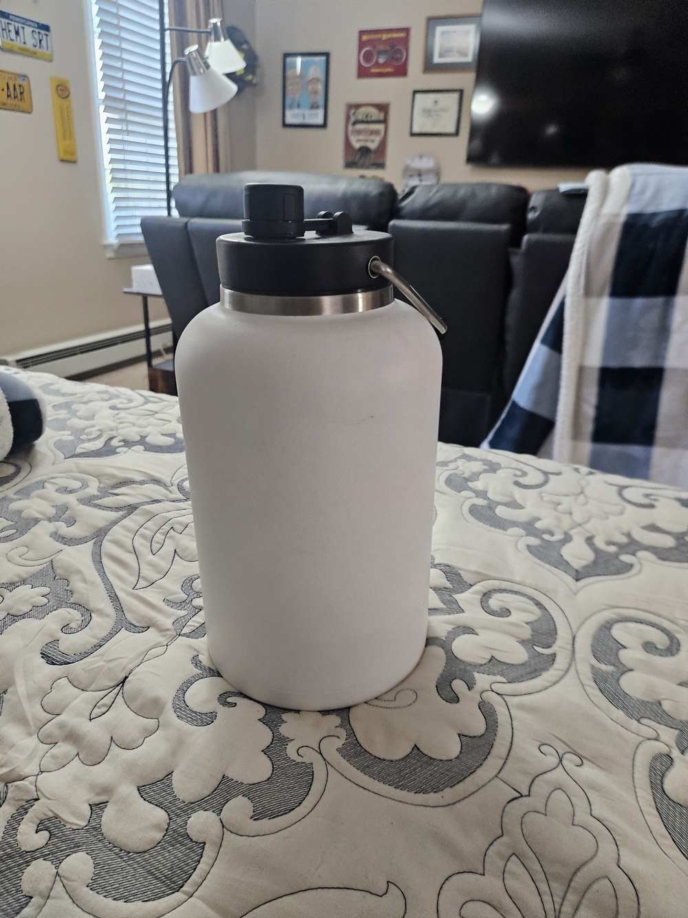 White Insulated Water Bottle with Black Screw Cap and Carry Loop